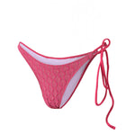 Photo détourée sur fond blanc du bas de maillot Bari rose fuschia avec de la ficelle sur le côté gauche