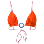 Photo détourée sur fond blanc du haut de maillot de bain Olbia orange à bretelles rose et avec un anneau bleu au centre