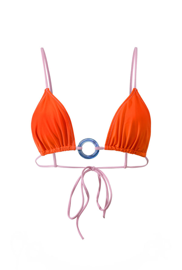 Photo détourée sur fond blanc du haut de maillot de bain Olbia orange à bretelles rose et avec un anneau bleu au centre